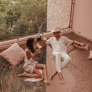 Couple enjoying drinks at Aflora Tulum