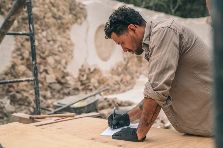 Alt text: Mike de Selva working on a construction project.